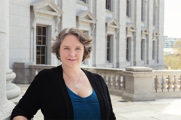 Mayor Satya Rhodes-Conway standing in front of the WI State Capitol.