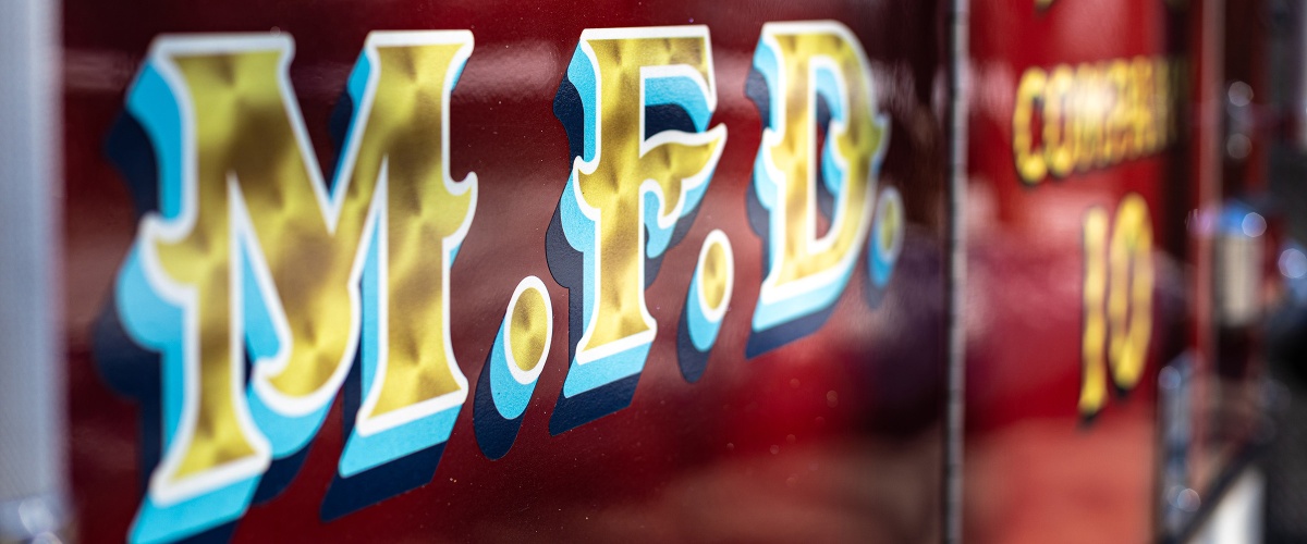 Side of a fire truck with the letters MFD